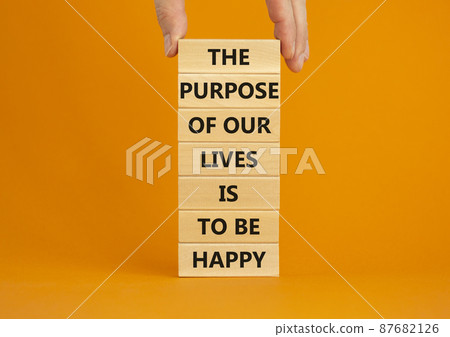 Purpose of happy lives symbol. Wooden blocks with words The purpose of our lives is to be happy. Beautiful orange background, copy space. Businessman hand. Business, purpose of lives is happy concept. Purpose of happy lives symbol. Wooden blocks with words The purpose of our lives is to be happy. Beautiful orange background, copy space. Businessman hand. Business, purpose of lives is happy concept. 87682126