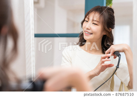 A woman with a hair set A woman with a hair set 87687510