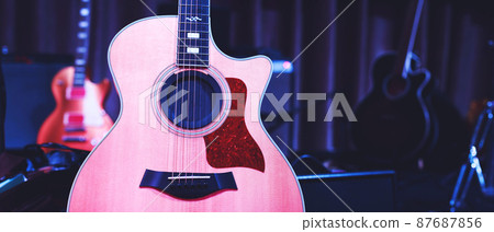 Acoustic guitar. Musical instrument with on stage in Concert. 87687856