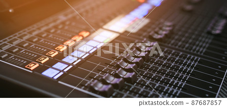 Recording Studio Mixing Desk with Music Producer on the concert stage Recording Studio Mixing Desk with Music Producer on the concert stage 87687857