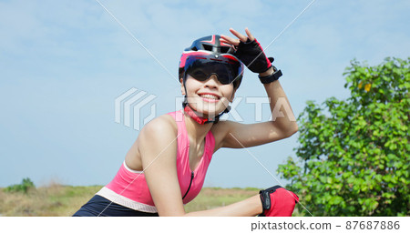 smiling female cyclist wear helmet smiling female cyclist wear helmet 87687886