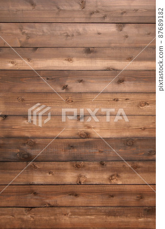 Vertical background image with brown boards with wood grain and knots 87689182