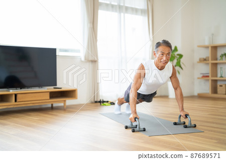 Senior man doing muscle training 87689571