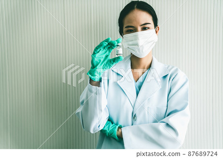 Skillful doctor prepare vaccine proficiently before injection Skillful doctor prepare vaccine proficiently before injection 87689724