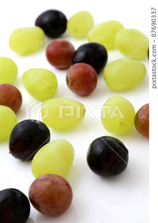 Japanese luxury grape grains, muscat, lighting, white background. Japanese luxury grape grains, muscat, lighting, white background. 87690337