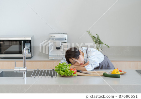 Tired female housewife kitchen 87690651
