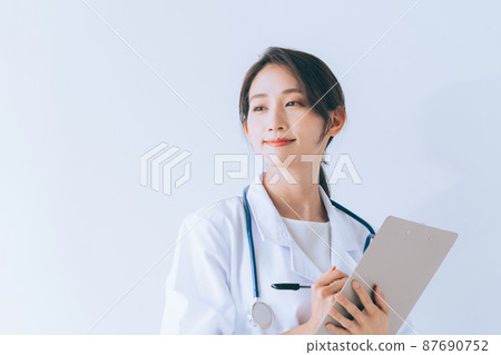 Smiling female doctor Smiling female doctor 87690752
