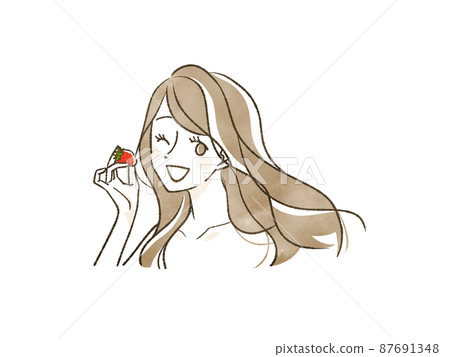 Woman holding a strawberry Woman holding a strawberry 87691348