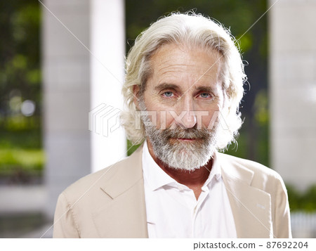 portrait of an caucasian european design professional looking at camera with serious facial expression 87692204