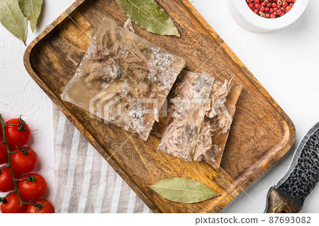 Homemade delicious jelly meat, on white stone table background, top view flat lay 87693082