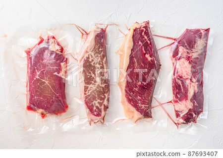 Set of vacuum packed organic raw beef alternative cuts 87693407