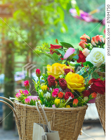 Beautiful bouquet roses flower artificial in vintage wicker basket. Artificial multicolor flowers made from cloth or fabric look like real flower. Retro style.Valentines Day concept. Selective focus. Beautiful bouquet roses flower artificial in vintage wicker basket. Artificial multicolor flowers made from cloth or fabric look like real flower. Retro style.Valentines Day concept. Selective focus. 87694750