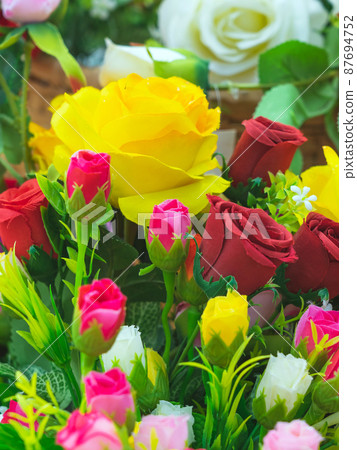 Beautiful bouquet roses flower artificial in vintage wicker basket. Artificial multicolor flowers made from cloth or fabric look like real flower. Retro style.Valentines Day concept. Selective focus. Beautiful bouquet roses flower artificial in vintage wicker basket. Artificial multicolor flowers made from cloth or fabric look like real flower. Retro style.Valentines Day concept. Selective focus. 87694752