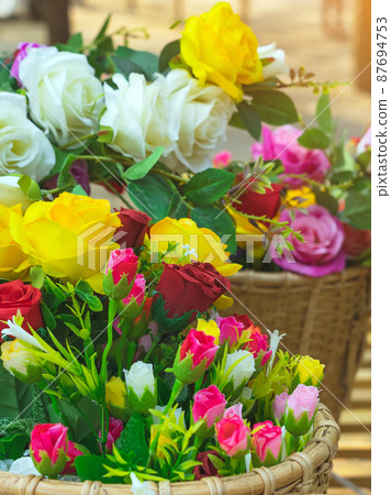 Beautiful bouquet roses flower artificial in vintage wicker basket. Artificial multicolor flowers made from cloth or fabric look like real flower. Retro style.Valentines Day concept. Selective focus. Beautiful bouquet roses flower artificial in vintage wicker basket. Artificial multicolor flowers made from cloth or fabric look like real flower. Retro style.Valentines Day concept. Selective focus. 87694753