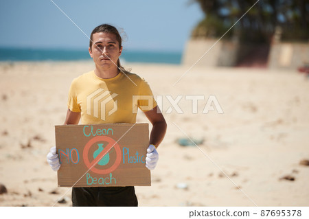 Volunteer Holding Environmental Poster 87695378