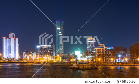 Early Spring night on the banks of the pond in the city center Early Spring night on the banks of the pond in the city center 87695536