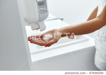 Doctor washing hands before operating in hospital. Health care and hygiene concept 87696894