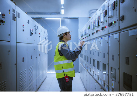 Engineer checking and inspecting at MDB panel .he working with electric switchboard to check range of voltage working in Main Distribution Boards factory. Engineer checking and inspecting at MDB panel .he working with electric switchboard to check range of voltage working in Main Distribution Boards factory. 87697781