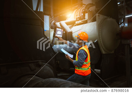 Industry engineer under checking the industry cooling tower air conditioner is water cooling tower air chiller HVAC of large industrial building to control air system. Industry engineer under checking the industry cooling tower air conditioner is water cooling tower air chiller HVAC of large industrial building to control air system. 87698016