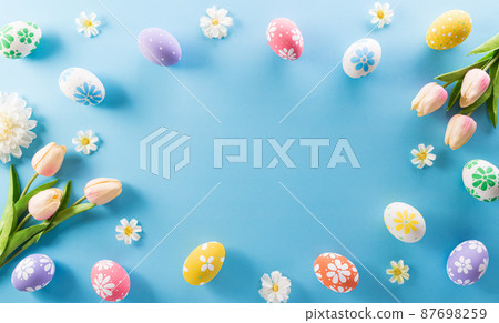 Happy easter! colourful Easter eggs with flower on pastel blue background. 87698259