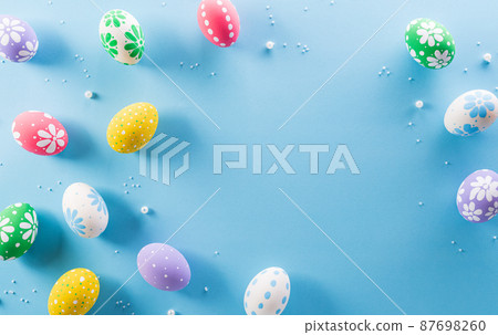 Happy easter! colourful Easter eggs with flower on pastel blue background. 87698260