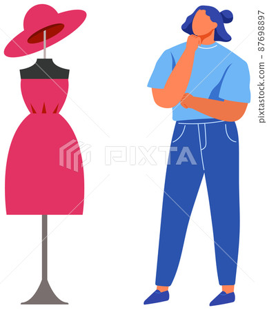 Fashion designer, dressmaker, seamstress during work. Lady looks at outfit, clothes on mannequin Fashion designer, dressmaker, seamstress during work. Lady looks at outfit, clothes on mannequin 87698897