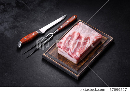 Close-up fat Salted lard homemade lard on a wooden board 87699227