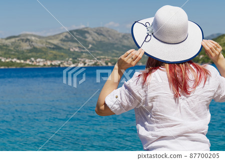 happy beautiful young woman enjoying freedom and the sea view, summer vacation happy beautiful young woman enjoying freedom and the sea view, summer vacation 87700205