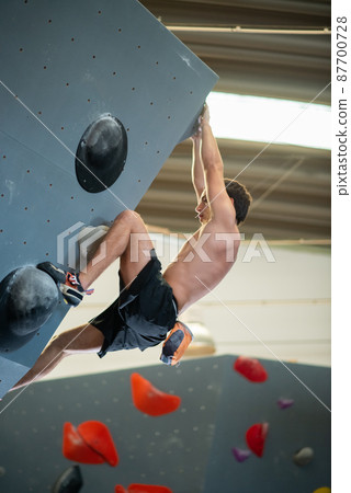 Side view of sportive man training Side view of sportive man training 87700728