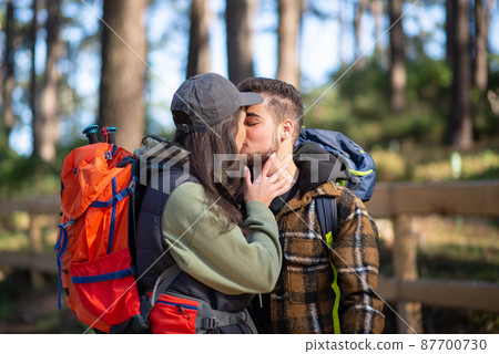Affectionate couple of young hikers Affectionate couple of young hikers 87700730