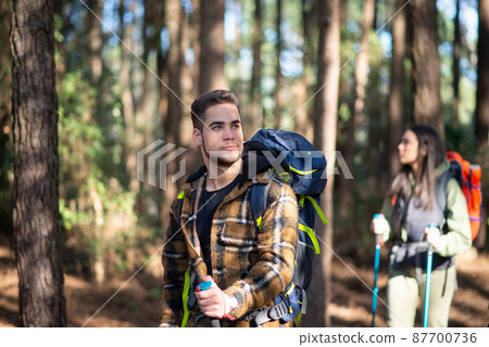 Active couple of young hikers Active couple of young hikers 87700736