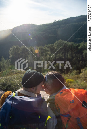 Tender couple hiking in autumn 87701075