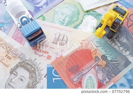 Banknotes, mixer trucks and excavators from countries around the world 87702796