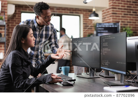 Multiethnic cyber security team developing software algorithm for information processing 87702896