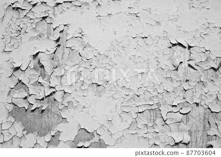 Mangy cracked paint on metal surface, background black and white Mangy cracked paint on metal surface, background black and white 87703604