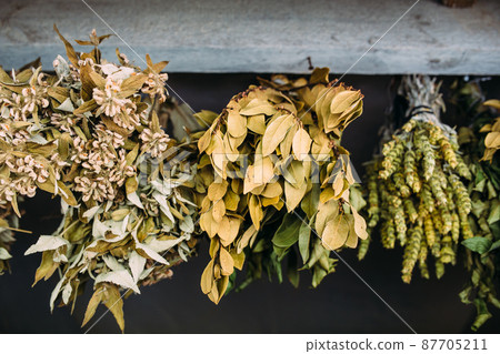 Bunches of dry medicinal plants. Bay leaves, lemongrass are dried Bunches of dry medicinal plants. Bay leaves, lemongrass are dried 87705211