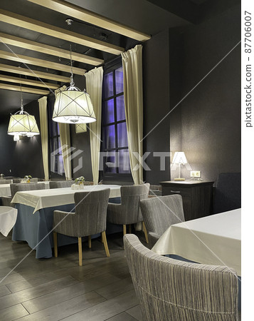 beautifully tables at evening in restaurant. Empty tablescloths beautifully tables at evening in restaurant. Empty tablescloths 87706007