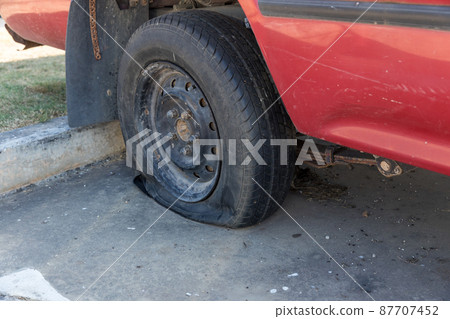 Destroyed blown out tire with exploded Destroyed blown out tire with exploded 87707452