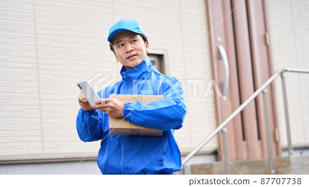 Man delivering luggage Man delivering luggage 87707738