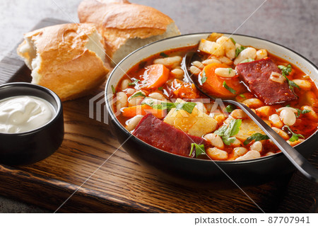 Babgulyas hungarian Soup With Beans, meat and vegetables closeup in the plate. Horizontal 87707941