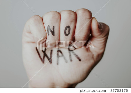 raised fist with the text no war written in it 87708176