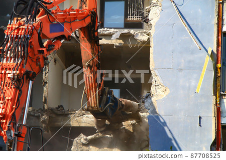 Building demolition by heavy machinery 87708525