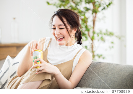 Woman drinking beer Woman drinking beer 87708929