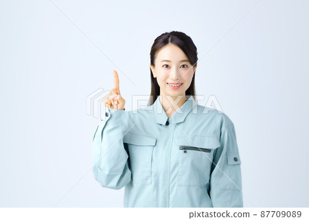 Young business woman in work clothes Young business woman in work clothes 87709089