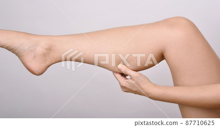 Calf fat, Fat woman pinching thigh leg skin, Overweight body test. 87710625