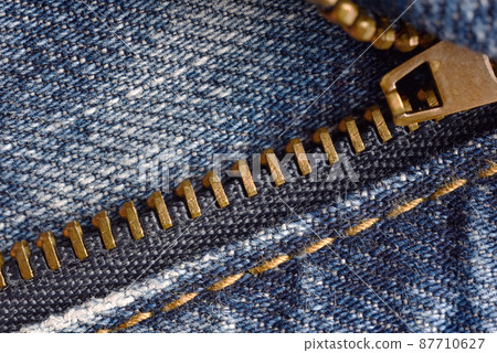 Zipper fastener, Macro of denim jeans pant zipper. 87710627
