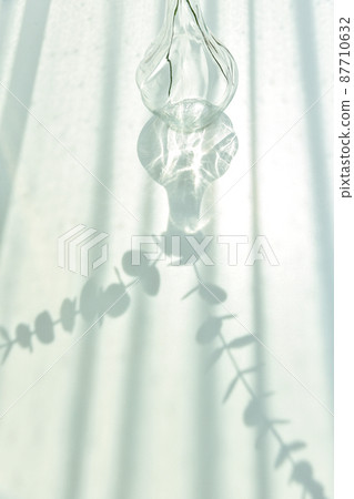 Glassware reflect sunlight shadow effect, Summer still life scene, Transparent glittering glasses Glassware reflect sunlight shadow effect, Summer still life scene, Transparent glittering glasses 87710632