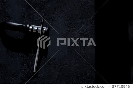 knife sharpener on dark surface knife sharpener on dark surface 87710946