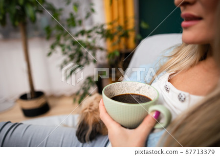 A morning with coffee and a four-legged canine friend. A morning with coffee and a four-legged canine friend. 87713379