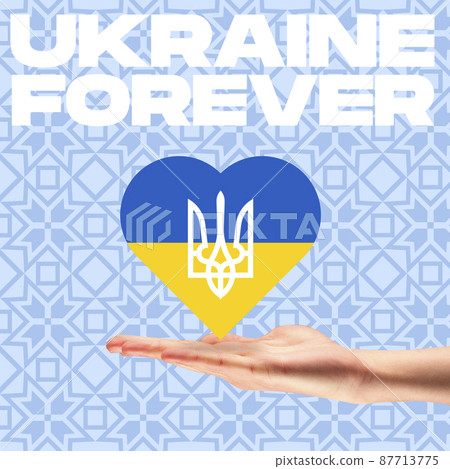 Conceptual image. Hand holding heart covered with blue and yellow flag colors with ukrainian coat of arms. Ukraine forever, homeland 87713775